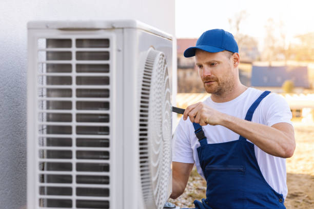HVAC technician servicing an outdoor air conditioner in Santa Barbara